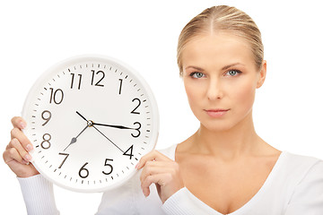 Image showing woman holding big clock