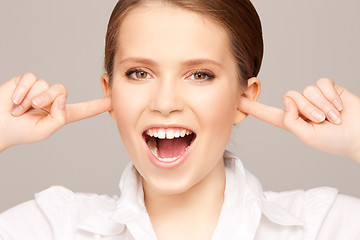 Image showing woman with fingers in ears