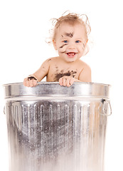 Image showing baby in trash can