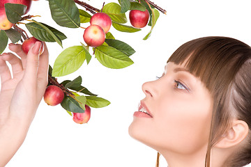 Image showing lovely woman with apple twig