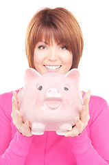 Image showing lovely woman with piggy bank  