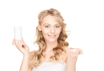 Image showing young woman with pills
