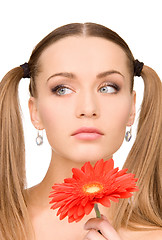 Image showing woman in towel with red flower