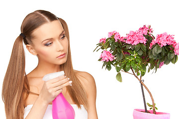 Image showing lovely housewife with flowers