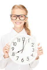 Image showing girl holding big clock