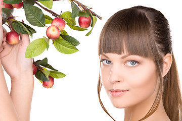 Image showing lovely woman with apple twig