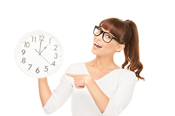 Image showing woman holding big clock