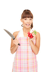 Image showing housewife with big knife and radish