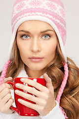 Image showing beautiful woman with red mug