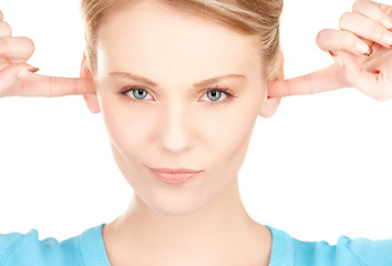 Image showing woman with fingers in ears