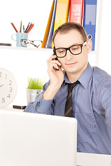 Image showing businessman with laptop computer in office