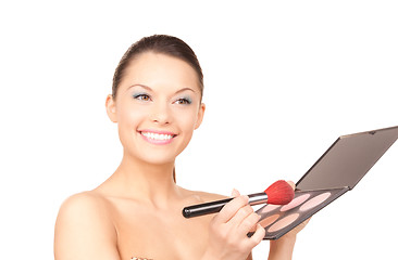 Image showing lovely woman with palette and brush