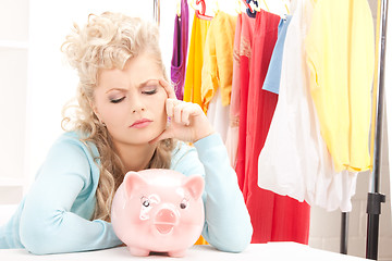 Image showing lovely woman with piggy bank