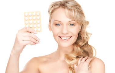 Image showing young woman with pills