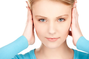 Image showing woman with hands on ears