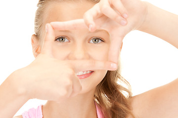 Image showing pretty girl creating a frame with fingers