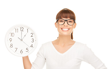 Image showing woman holding big clock