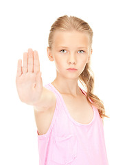 Image showing lovely girl showing stop sign