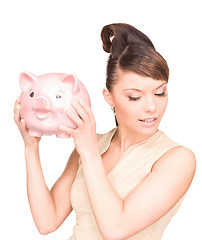 Image showing lovely woman with piggy bank