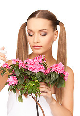 Image showing lovely housewife with flowers