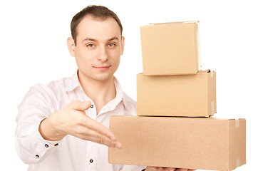 Image showing businessman with parcels