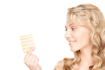 Image showing young woman with pills