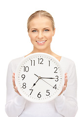 Image showing woman holding big clock