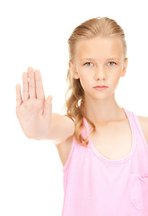 Image showing lovely girl showing stop sign