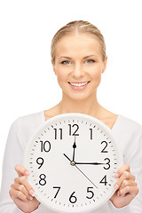 Image showing woman holding big clock