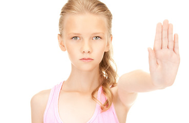 Image showing lovely girl showing stop sign