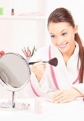 Image showing lovely woman with brush and mirror