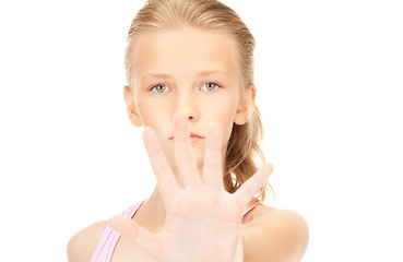 Image showing lovely girl showing stop sign