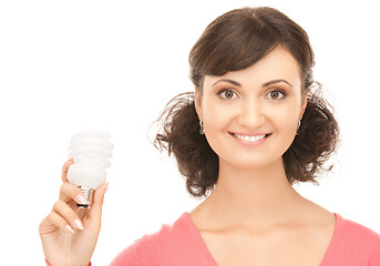 Image showing woman holding energy saving bulb