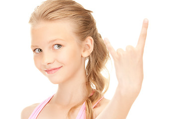 Image showing happy girl showing devil horns gesture