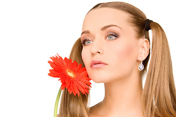 Image showing woman in towel with red flower