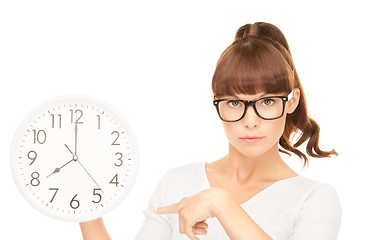 Image showing woman holding big clock