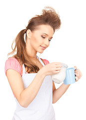 Image showing housewife with milk and mug