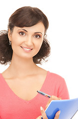 Image showing young attractive businesswoman with notebook