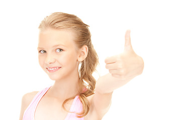Image showing lovely girl showing thumbs up sign