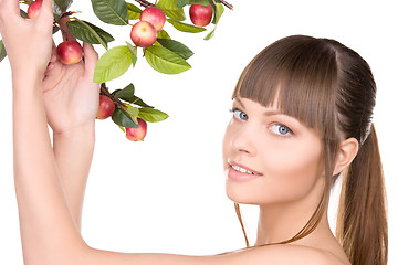 Image showing lovely woman with apple twig