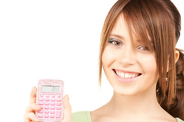 Image showing lovely teenage girl with calculator