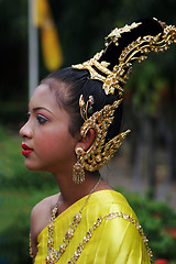 Image showing Woman in bright traditional dress during a parade in Phuket, Tha