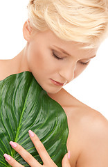 Image showing woman with green leaf