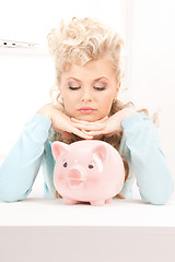 Image showing lovely woman with piggy bank