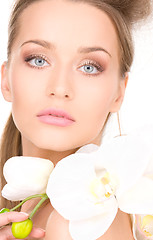 Image showing beautiful woman with white flower