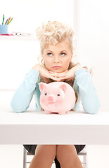 Image showing lovely woman with piggy bank