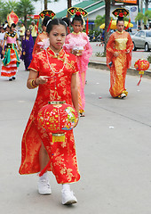 Image showing Thai student holds a Chinese lantern during a parade, Phuket, Th