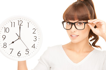 Image showing woman holding big clock