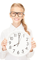 Image showing girl holding big clock