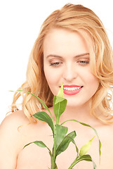 Image showing woman with sprout over white